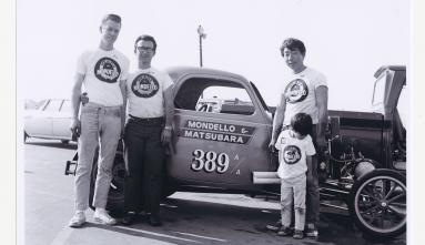 Drag racer Sush Matsubara and crew in front of race car